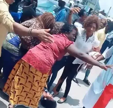 Drama as lady goes into labour while queuing for cash at bank in Port Harcourt (Video)