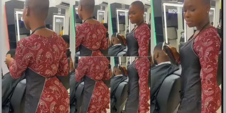 "U dey do home service abeg?" - Reactions as curvy lady barber whines waist as she trims customer's hair (Video)