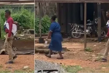 Nigerian man causes a stir as he carries his baby on his back while walking with wife on the road (Video)