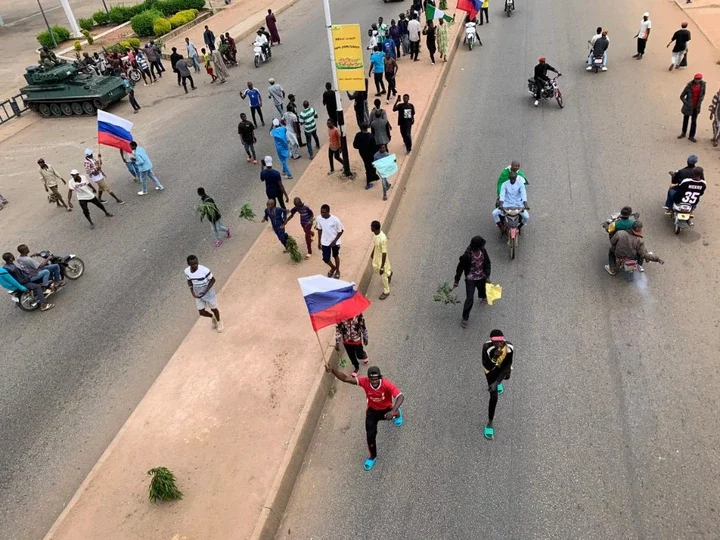 #EndBadGovernance Protesters Call for Help as Russian, Japanese Flags Spotted in Jos (Pictures)