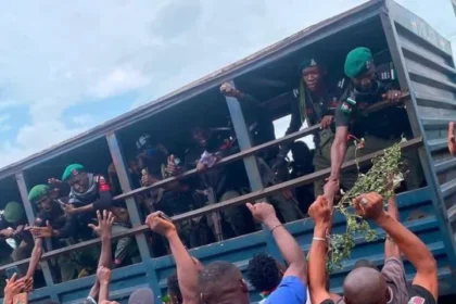 Reactions Trail Photo Of Policemen Shaking Some Protesters Who Were Hailing Them From Their Vehicle