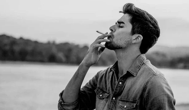 guy smoking cigarette