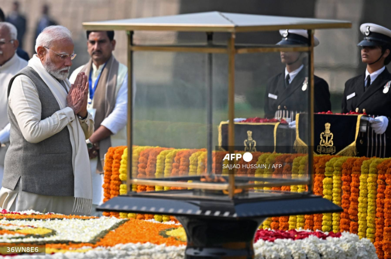 India’s Prime Minister Narendra Modi pays his respect at the Mahatma Gandhi memorial at Rajghat on Gandhi’s death anniversary in New Delhi on January 30, 2025. The death anniversary of Gandhi is also observed as Martyr’s Day in the country. (Photo by Sajjad HUSSAIN / AFP)